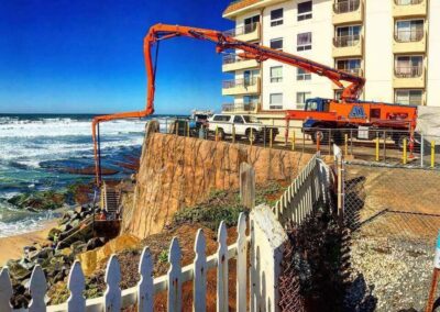 Concrete Pump pumping over seawall